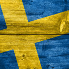 Sweden Flag painted on old wood plank background
